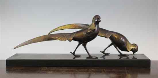 Appraisal: An Art Deco painted bronze group of two golden pheasants