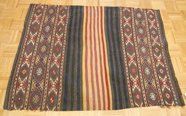 Appraisal: Tribal-Style Carpet Earth-tones loosely woven back ' x ' Provenance