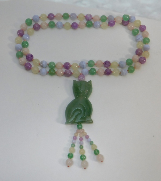 Appraisal: CHINESE CELADON LAVENDER BEAD JADE CAT NECKLACE China Early th