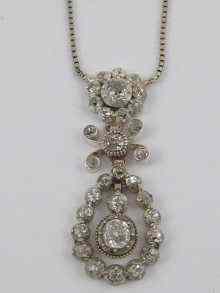 Appraisal: A white metal tests ct gold diamond pendant and chain