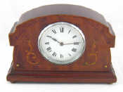 Appraisal: An Edwardian inlaid mahogany mantel clock with white enamel dial