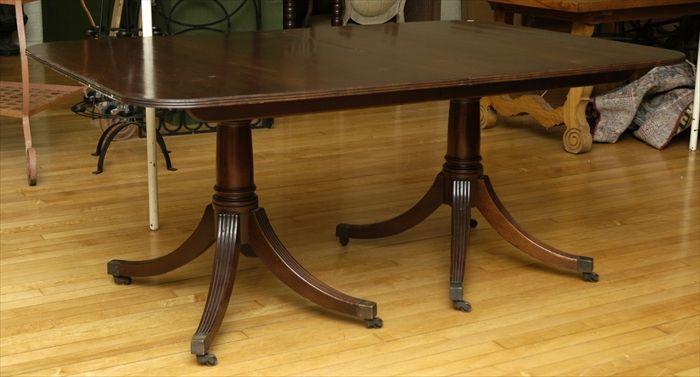 Appraisal: Regency-Style Mahogany Two-Pedestal Extending Dining Table With three leaves in