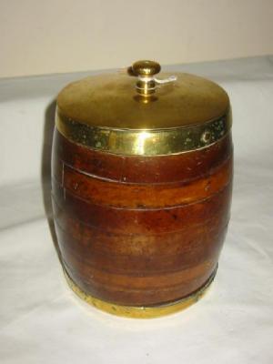 Appraisal: A STAINED WOOD TOBACCO JAR of barrel form with coopered