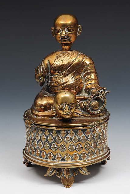 Appraisal: A Chinese bronze nodding head Buddha th Centurywith right hand