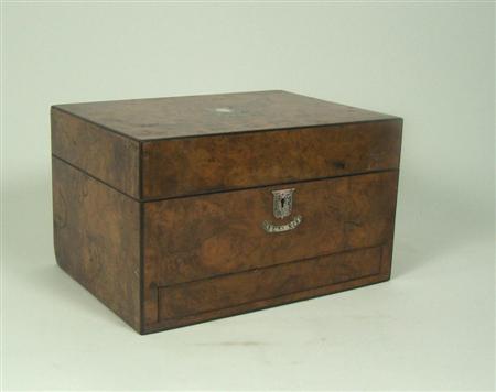 Appraisal: A Victorian walnut dressing case the hinged lid centred by