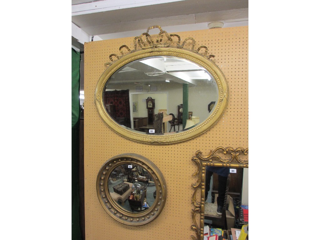 Appraisal: Regency giltwood convex wall mirror and an oval giltwood wall