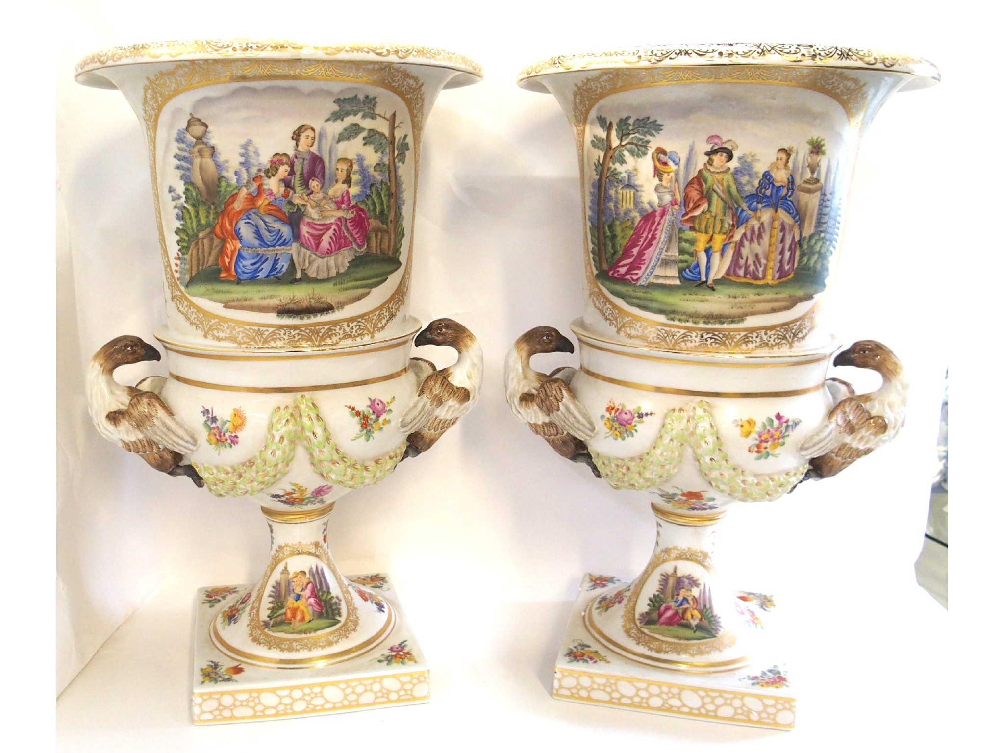 Appraisal: Large pair of urns with eagle handles and painted figural