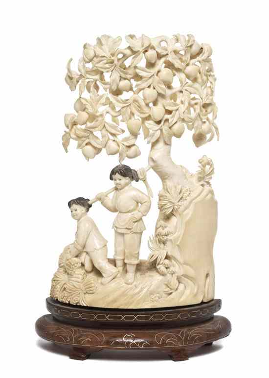 Appraisal: A Chinese Ivory Carving of Children Under a Peach Tree