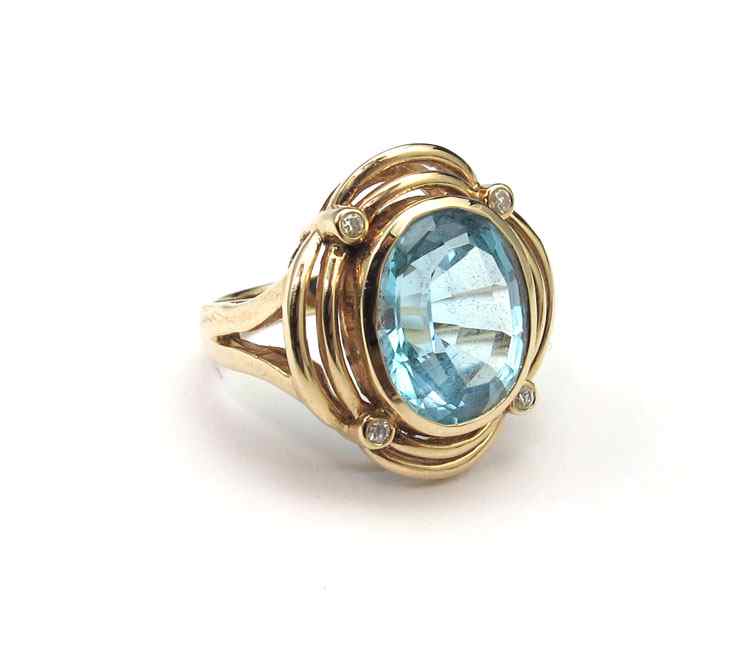 Appraisal: K TOPAZ DIAMOND RING K yellow gold ring contains one