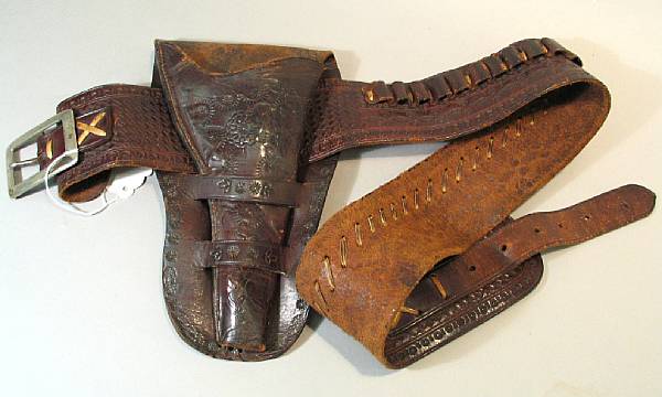 Appraisal: A vintage western gun rig Unmarked brown leather holster for