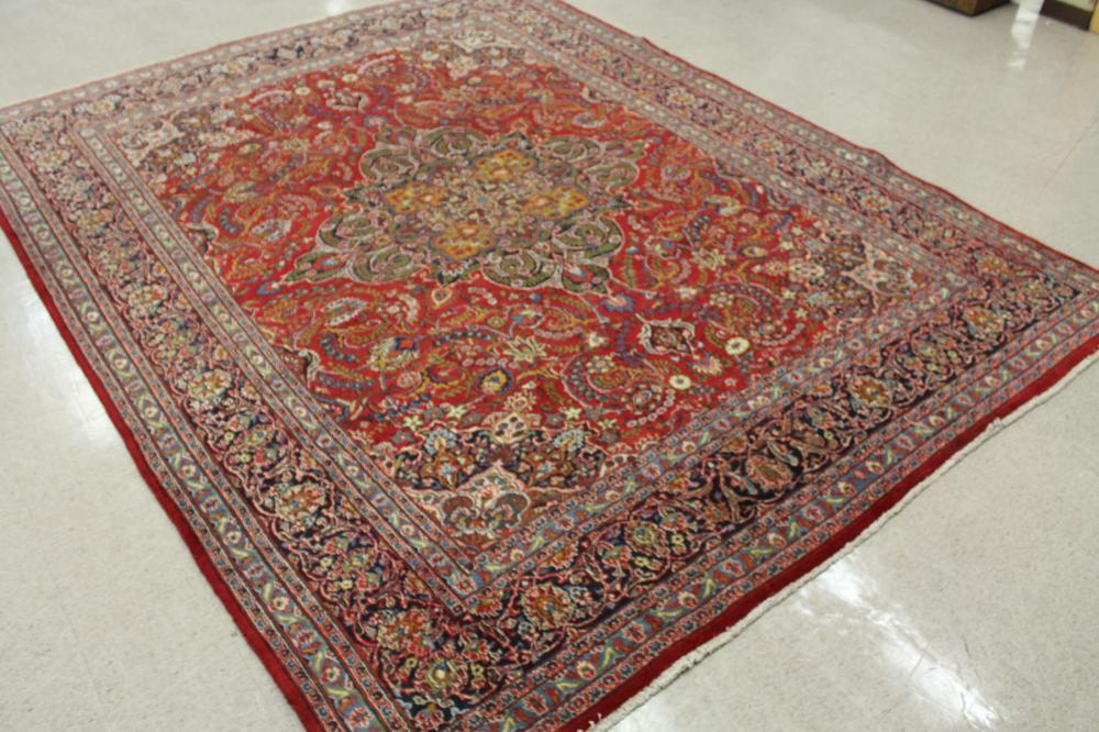 Appraisal: HAND KNOTTED PERSIAN CARPET floral and central floral medallion design