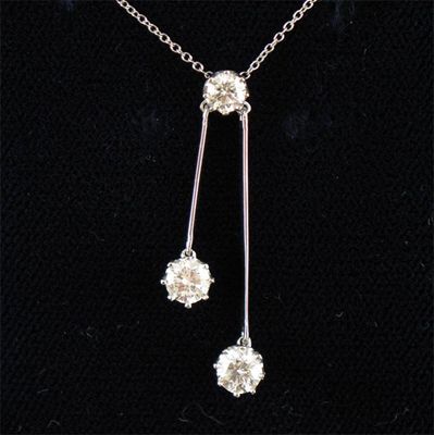 Appraisal: A pendant set with three brilliant cut diamonds set in