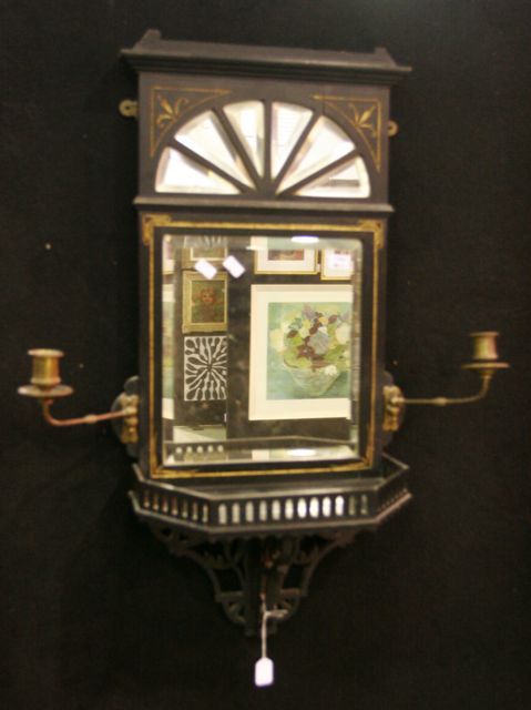 Appraisal: A Victoria wall mounted mirror with brass candle holders