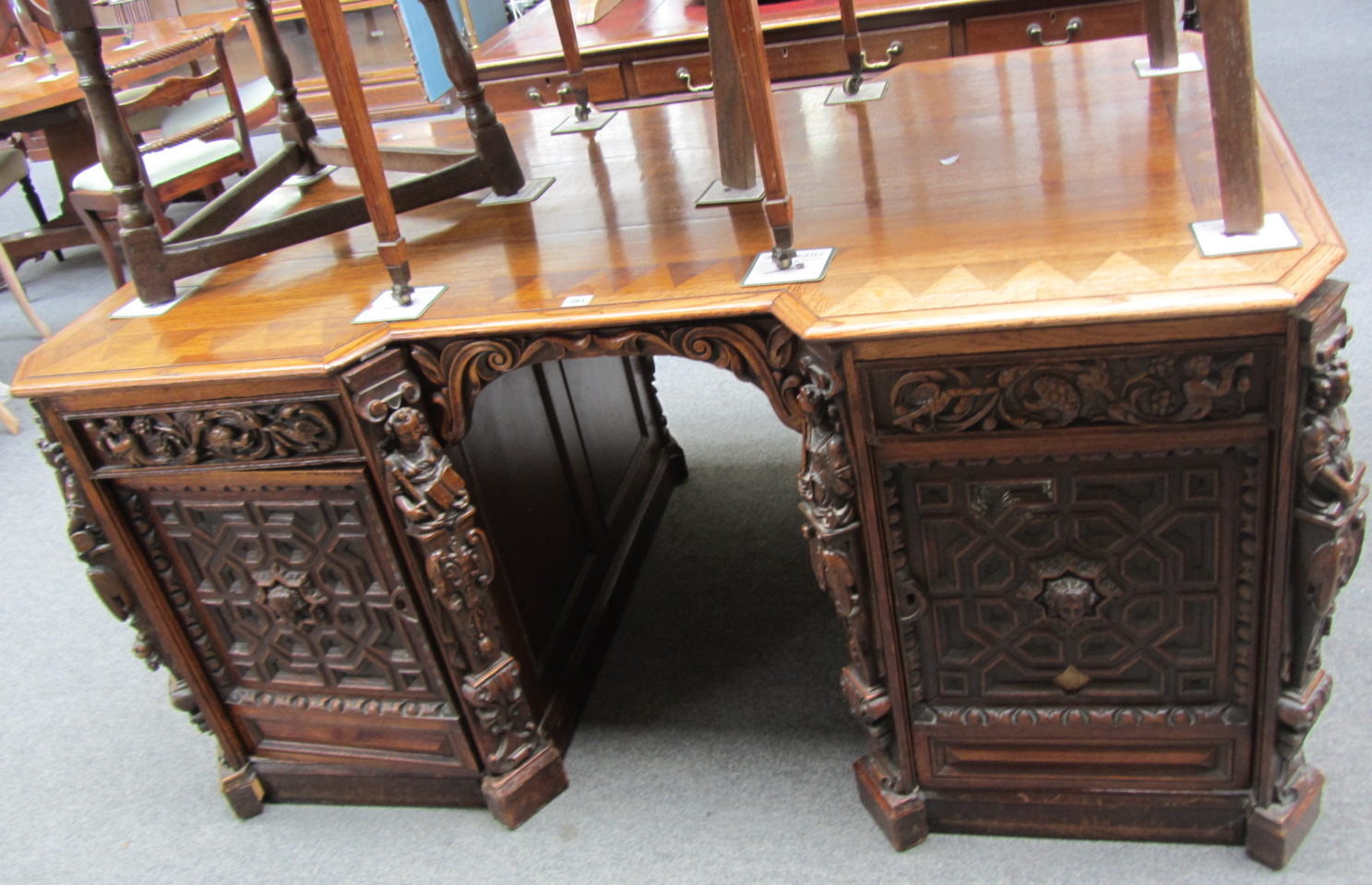 Appraisal: A th century continental carved oak partners desk each pedestal