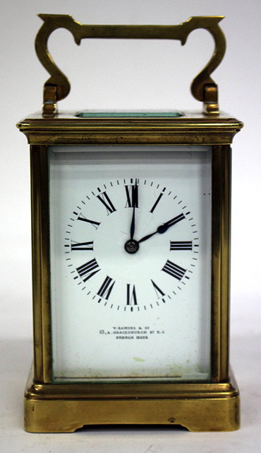 Appraisal: AN EARLY TH CENTURY BRASS CARRIAGE CLOCK the white enamelled