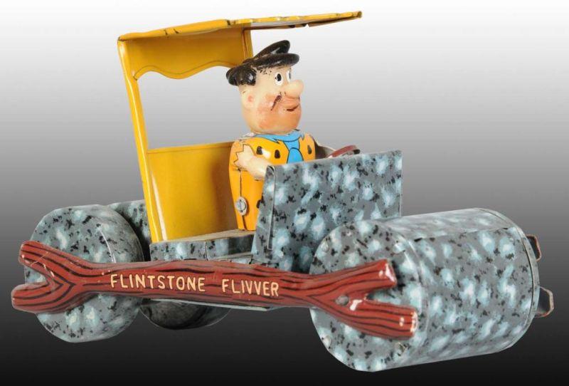 Appraisal: Marx Tin Friction Fred Flintstone Flivver Toy Description Toy includes