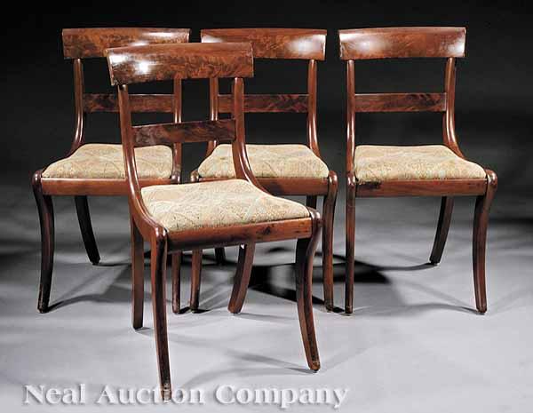 Appraisal: A Suite of Four American Classical Mahogany Dining Chairs th