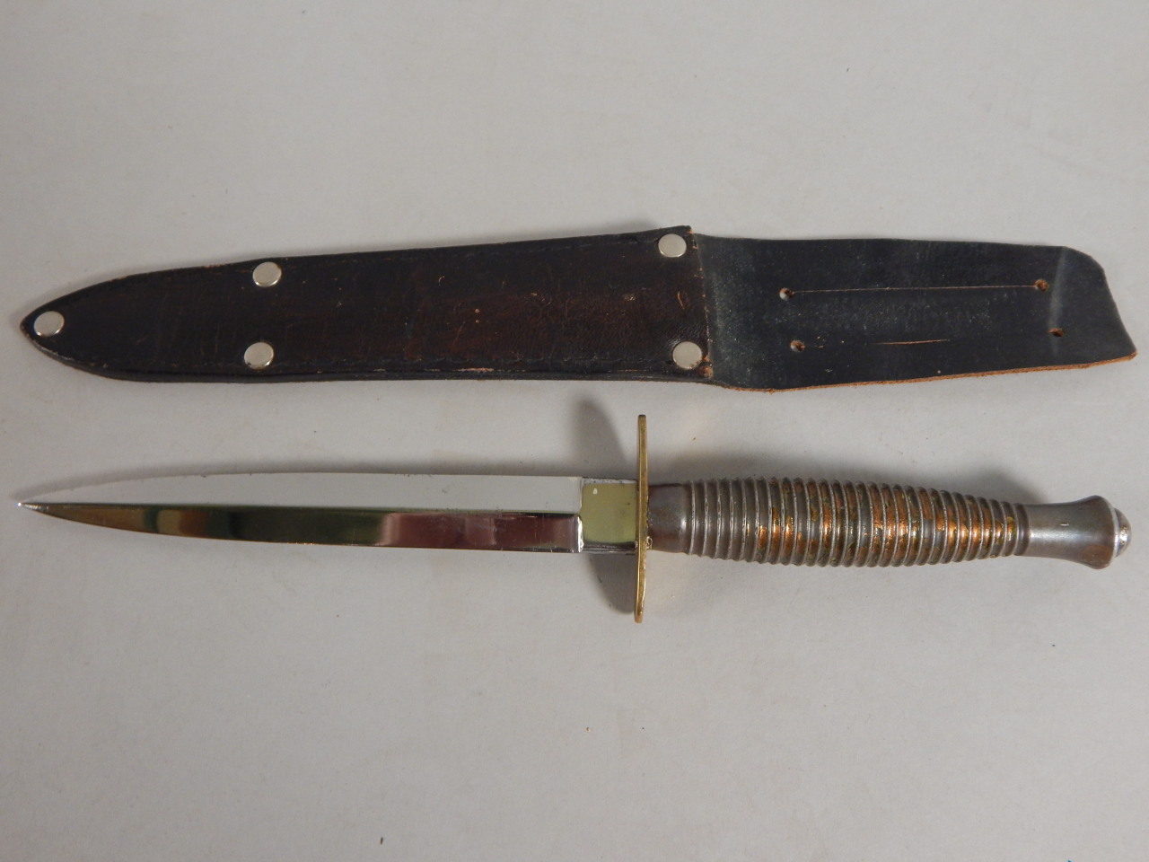 Appraisal: A Fairbairn-Sykes third pattern British Commando knife stamped xxOKES CROOK