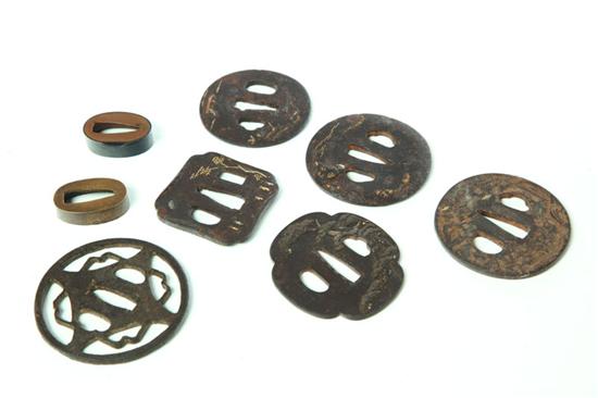 Appraisal: EIGHT SWORD FITTINGS Japan probably th century Six iron tsuba