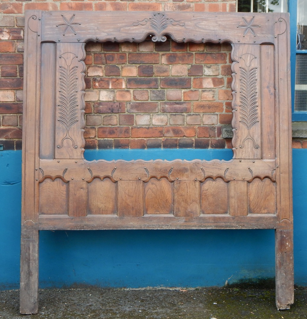 Appraisal: A late th early thC French oak bed head carved