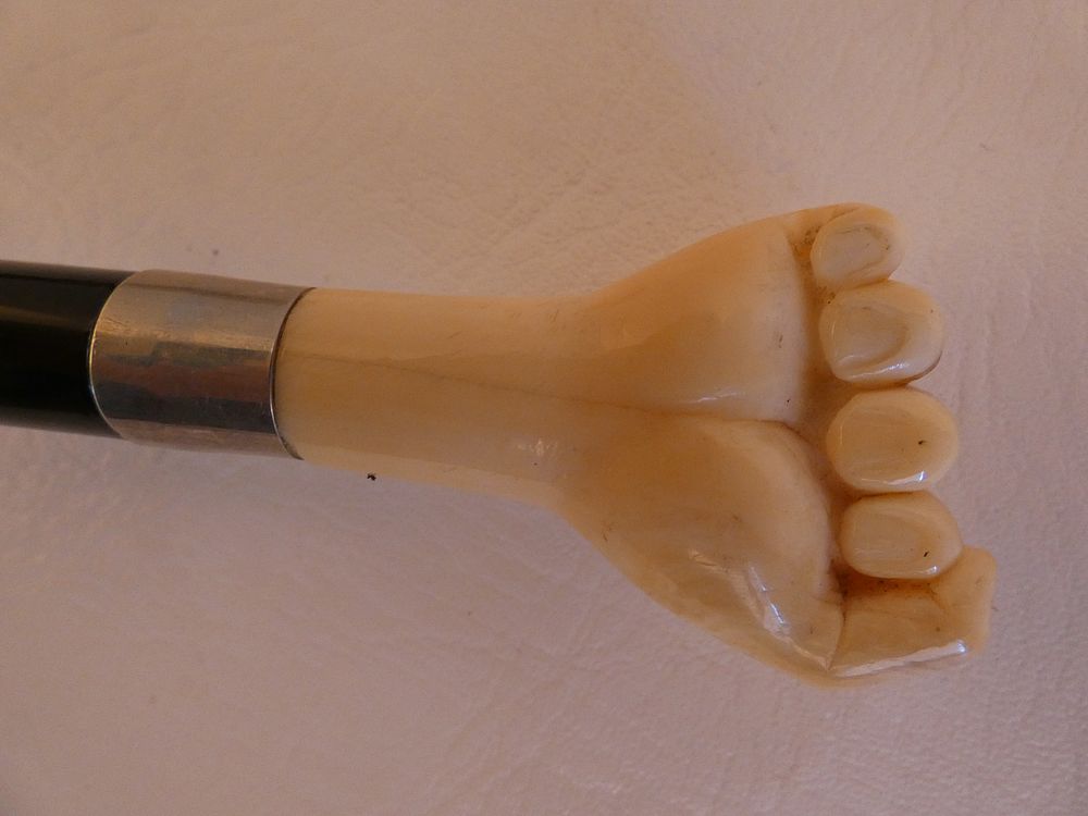 Appraisal: ANTIQUE BONE CLENCHED FIST CANE Antique cane with carved bone