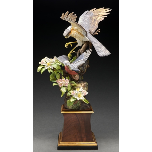 Appraisal: A Royal Worcester group of Sparrowhawk and Bullfinch designed by