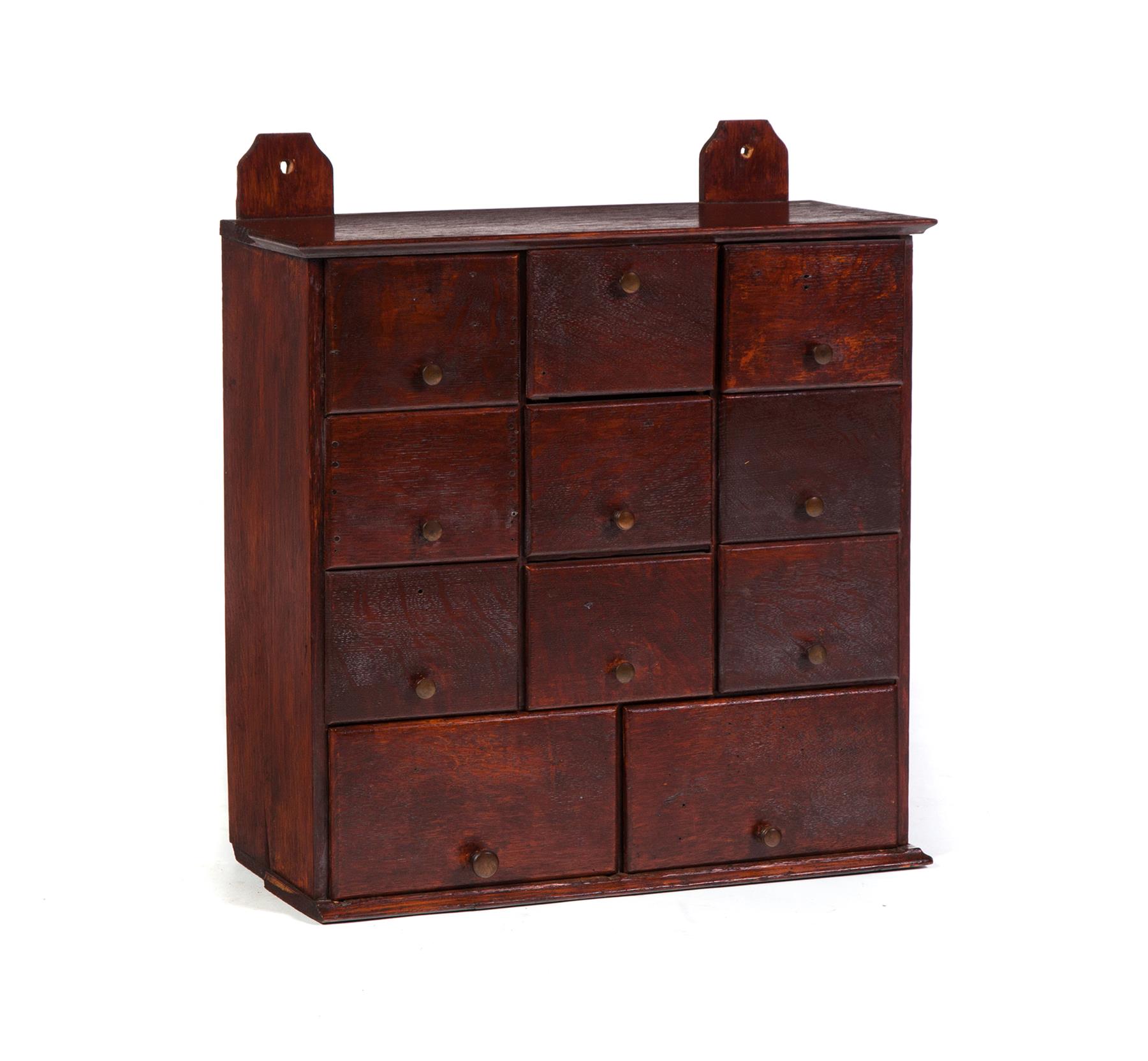 Appraisal: HANGING SPICE CABINET WITH ELEVEN DRAWERS American late th century