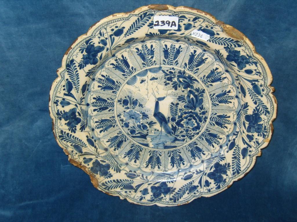 Appraisal: An th century tin glazed earthenware charger with shaped border