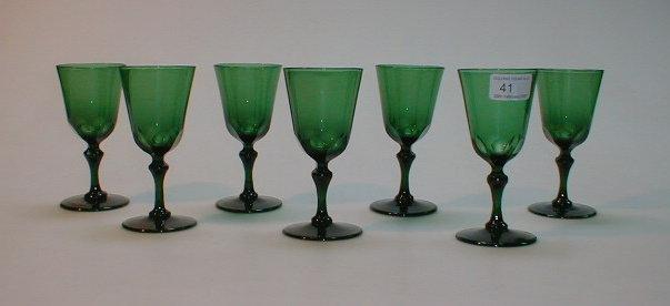 Appraisal: A set of seven thC green glass wines with faceted