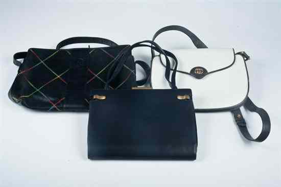 Appraisal: THREE DESIGNER LEATHER HANDBAGS Comprisng Gucci navy blue bag with