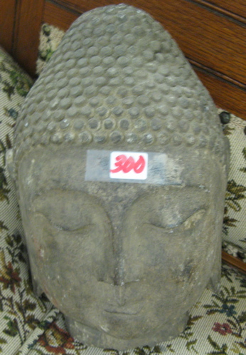 Appraisal: HEAD OF GAUTAMA BUDDHA granite sculpted having down cast eyes