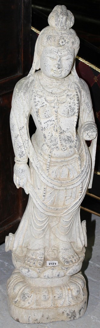 Appraisal: A carved stone figure of Buddha th century standing on