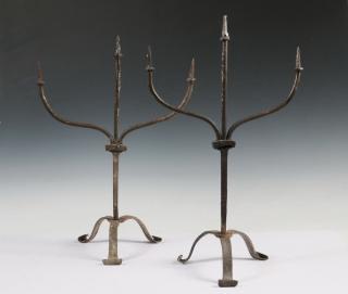 Appraisal: IRON TORCHIERES Pair of Three-Arm Gothic Forged Iron Pricket Torchieres