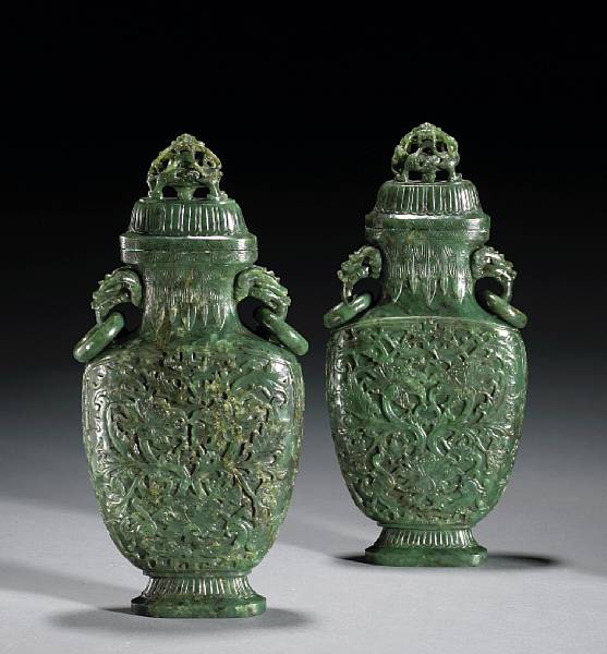 Appraisal: A pair of 'spinach' jade covered vases th Century Each