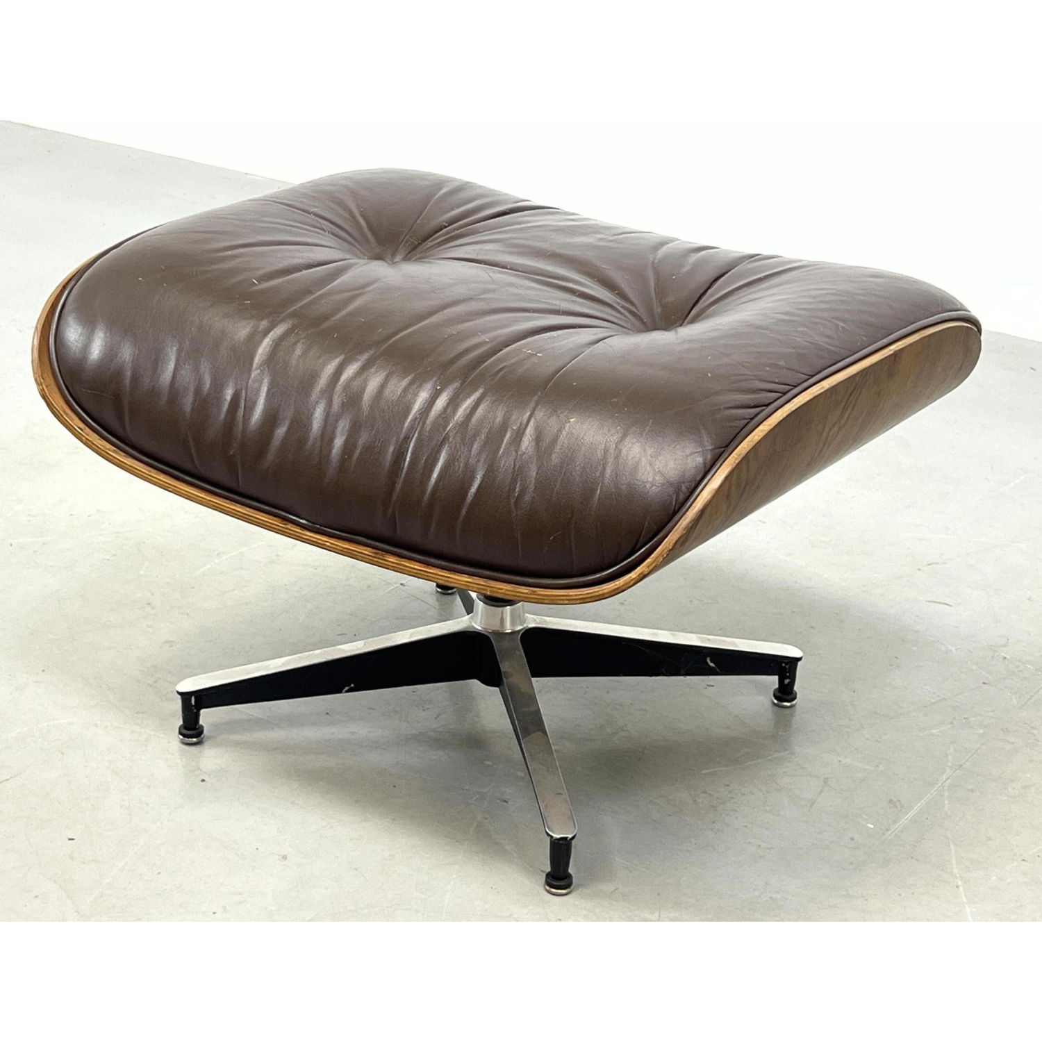 Appraisal: CHARLES EAMES for HERMAN MILLER Ottoman Brown leather upholstery Rosewood