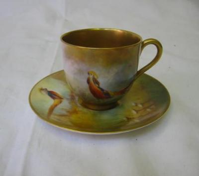 Appraisal: A ROYAL WORCESTER PORCELAIN CABINET CUP AND SAUCER painted with