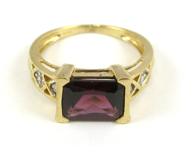 Appraisal: GARNET DIAMOND AND FOURTEEN KARAT GOLD RING set with two