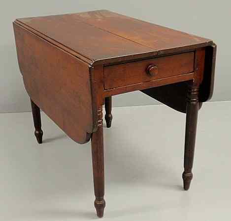 Appraisal: Sheraton cherry drop-leaf table c with a single drawer and