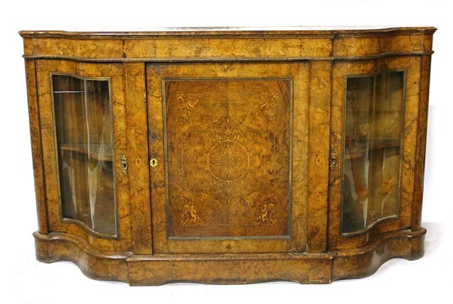 Appraisal: A Victorian marquetry inlaid walnut credenza the serpentine top over