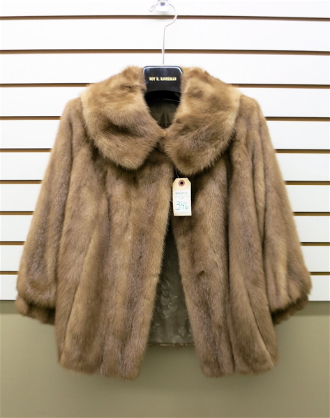 Appraisal: LADY'S MINK FUR COAT having brown fur two exterior pockets