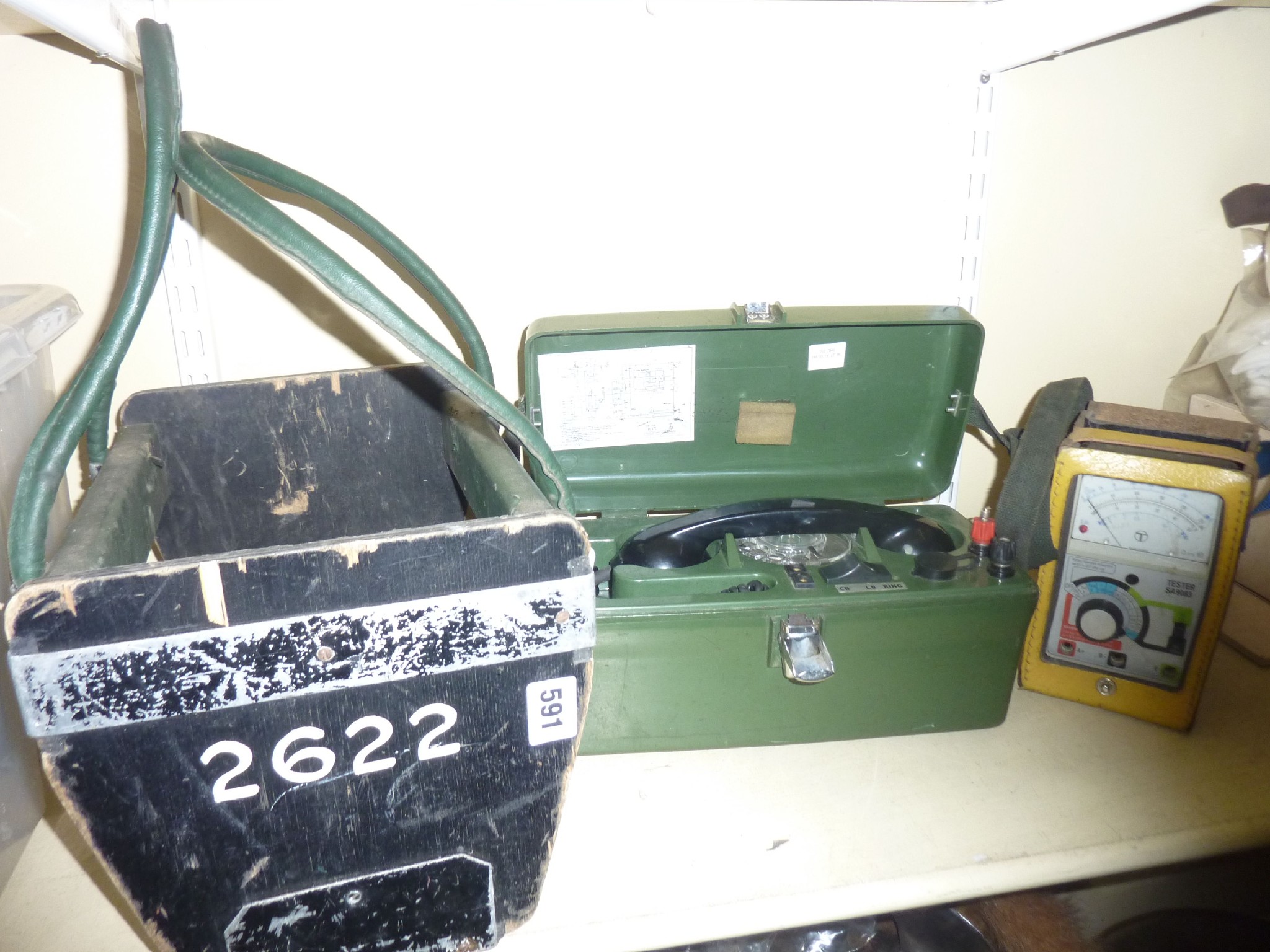 Appraisal: A cased military field telephone unit together with a field