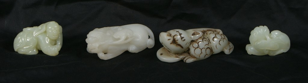 Appraisal: carved jade hardstone carvings crouching man foo dogs longest