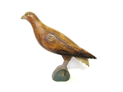 Appraisal: Carved and painted figure of a falconThe full-bodied figure perched