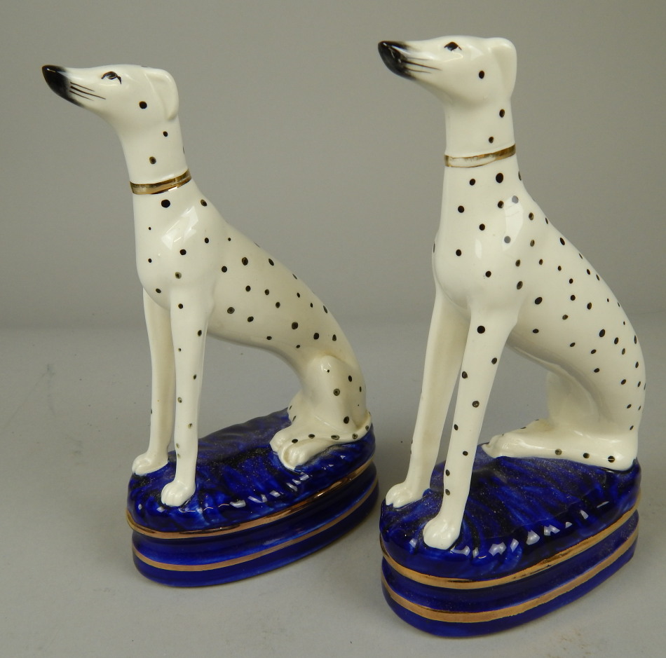 Appraisal: A pair of modern Staffordshire type models of Dalmatians each