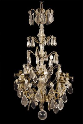 Appraisal: A brass and glass eight light chandelier hung with shaped