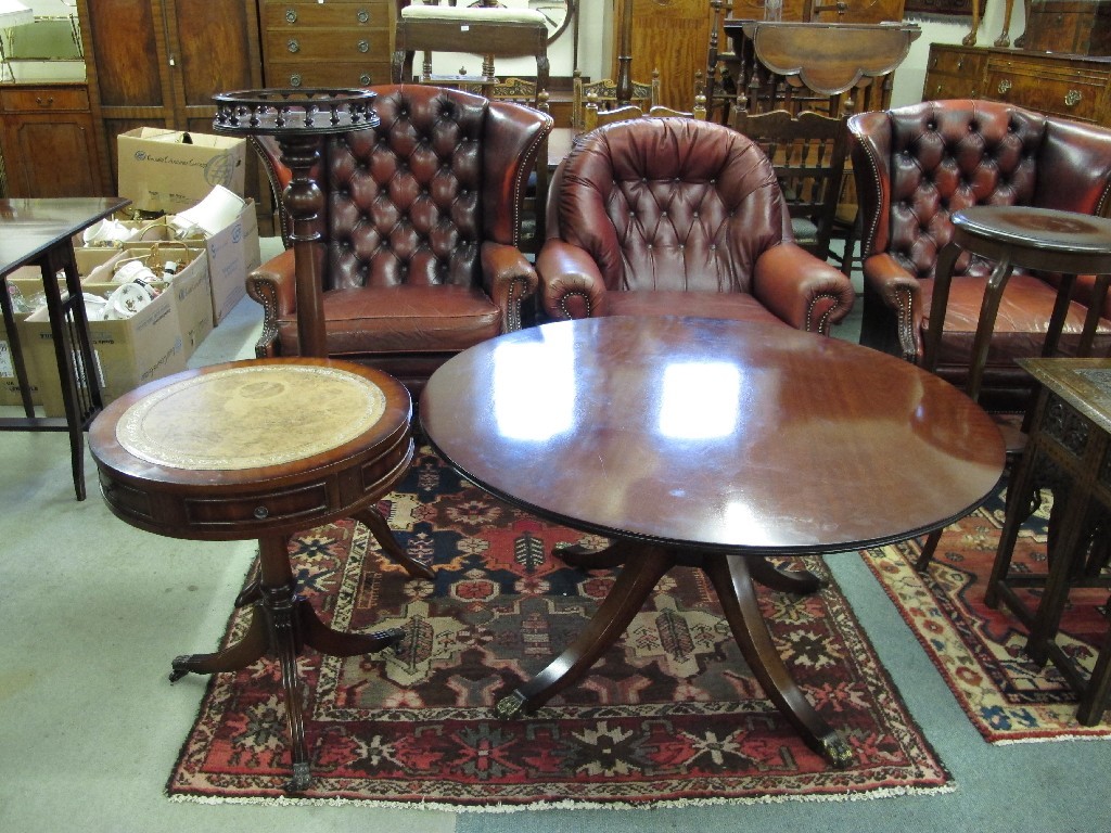 Appraisal: Reproduction swivel drum occasional table circular coffee table and plant