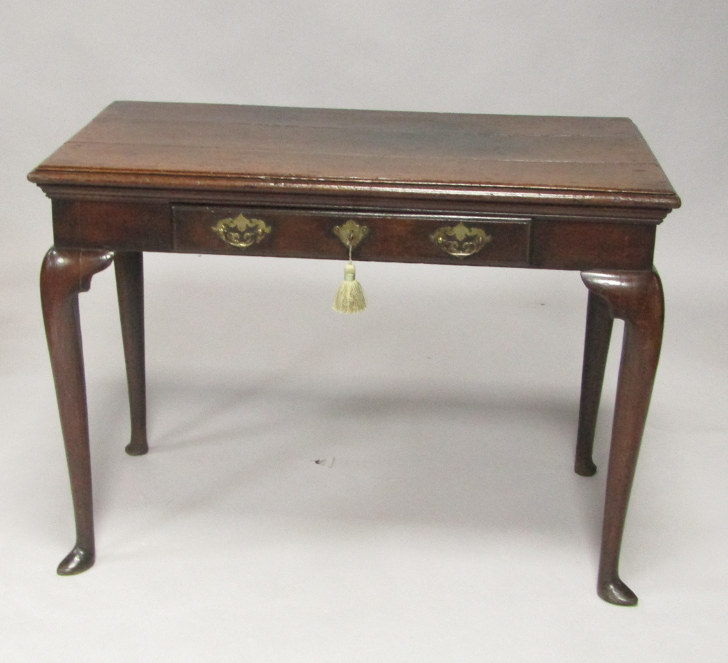 Appraisal: A George II oak side table with single frieze drawer