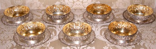 Appraisal: Title Finger Bowls and Under plates with floral repousse borders