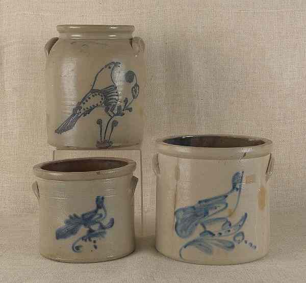 Appraisal: Three stoneware crocks th c with cobalt bird decoration h