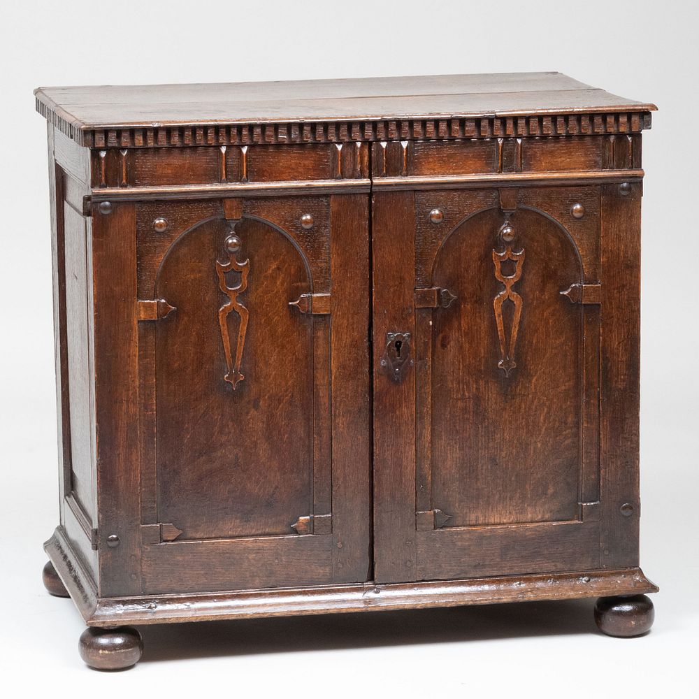 Appraisal: English Carved Oak Side Cabinet The pair of cabinet doors